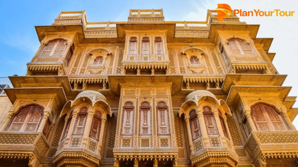 Salim Singh ki Haveli,  The majestic palace of the king in Jaisalmer, showcasing intricate architecture and golden sandstone against a clear sky.