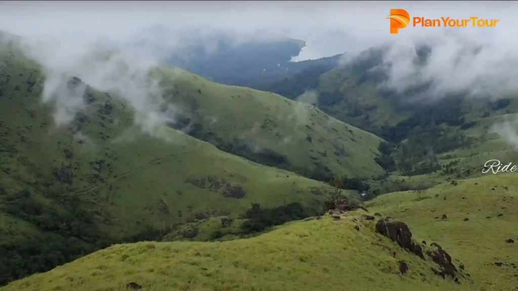 a green hills with clouds of Banasura Hill, best place to go in Wayanad
 