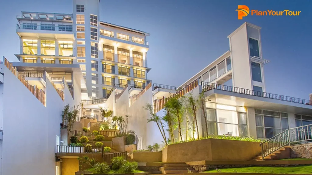 a building with stairs and plants of Fragrant Nature Munnar, top resorts in Munnar
