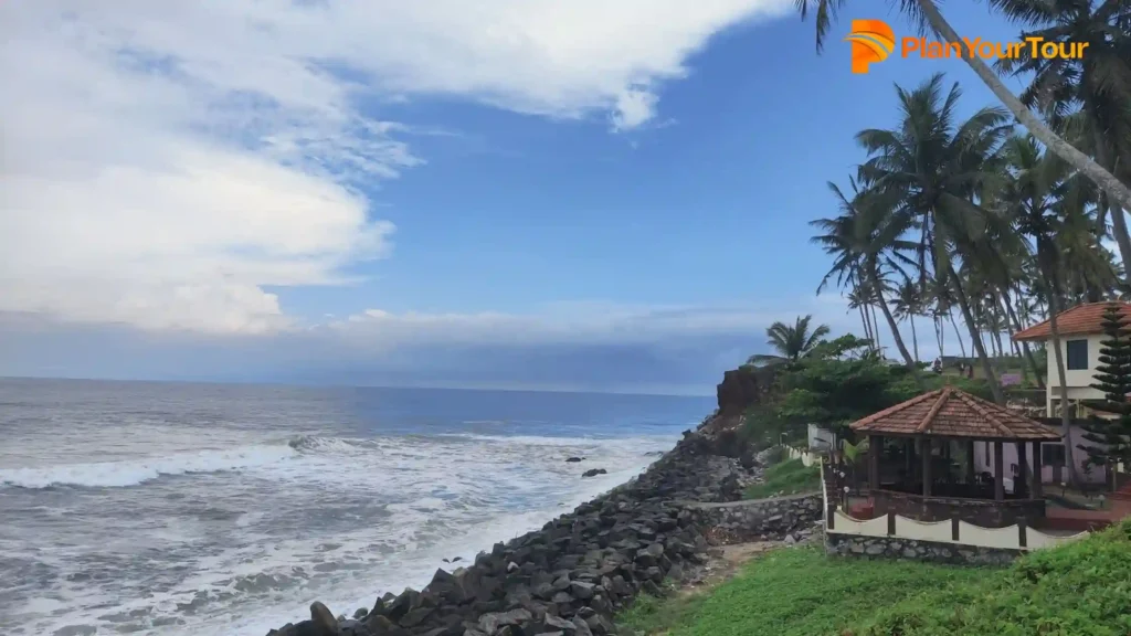 Odayam beach with a house and palm trees, best tourist spot in Varkala
