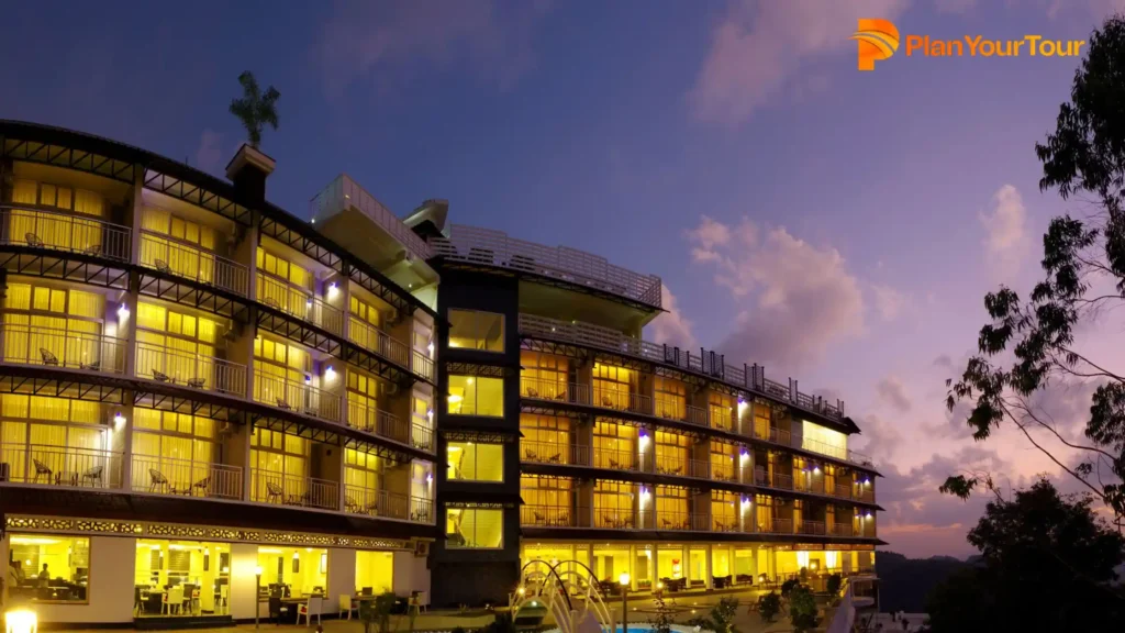 a building with lights on of The Panoramic Getaway Munnar which is best Resorts in Munnar
