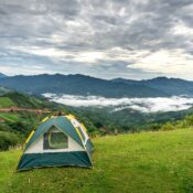 Munnar tent camping with scenic mountain views and lush green hills